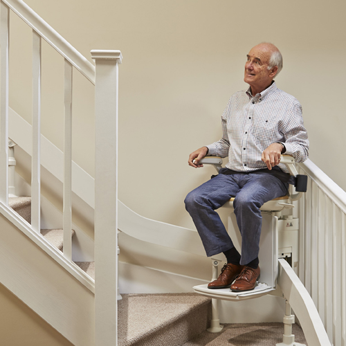 Man on curved stairlift