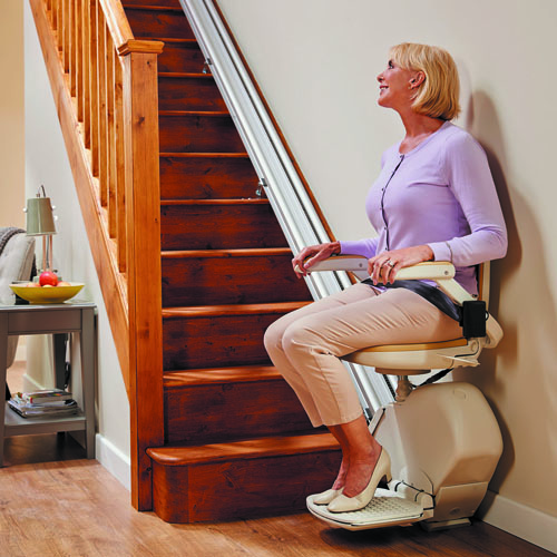 Lady on straight stairlift